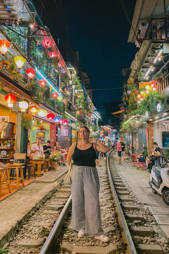 Rachel on Hanoi's Train Street, a hidden gem and unique thing to do in Hanoi, Vietnam.
