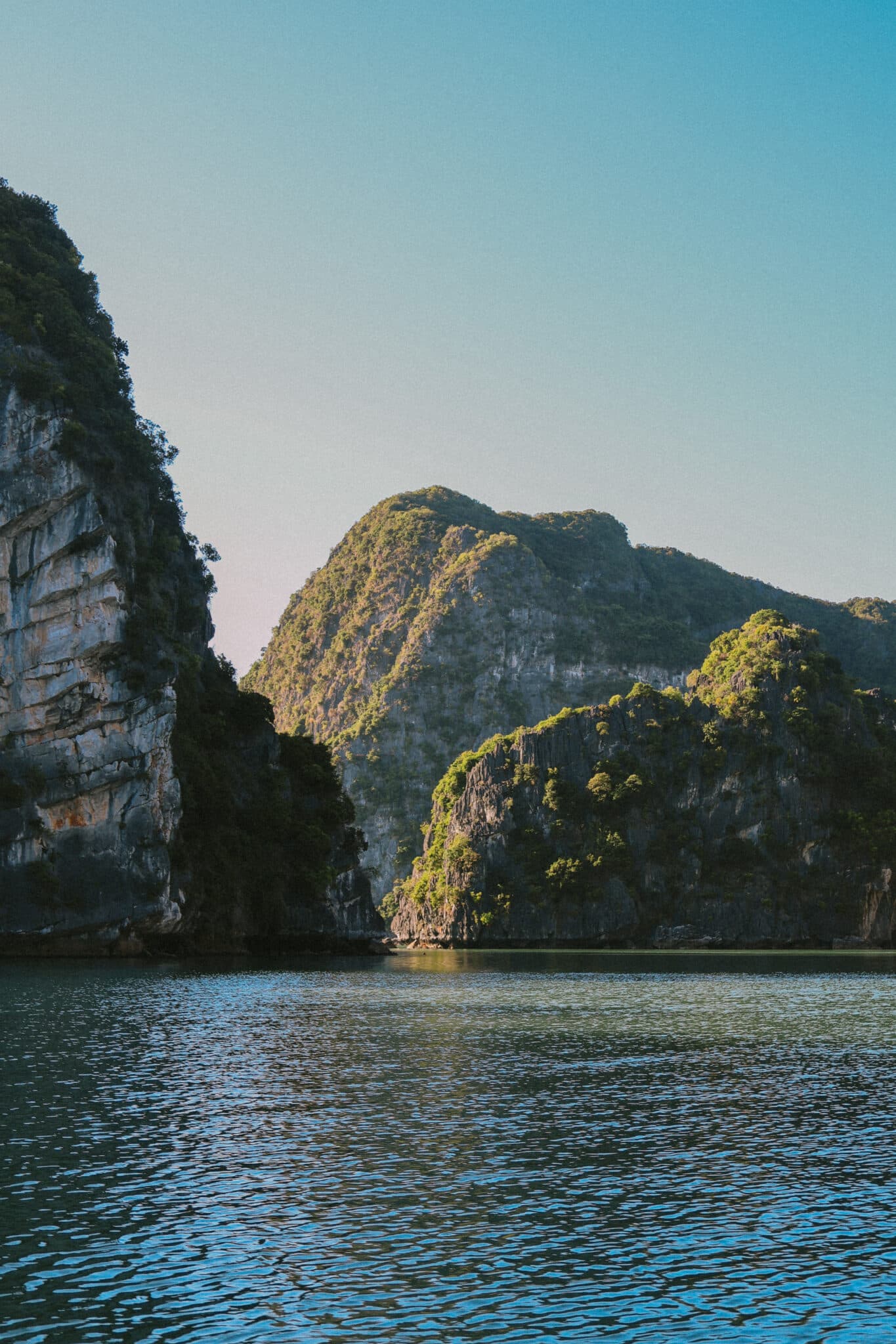 L'Amour Junk luxury Ha Long Bay cruise navigating between limestone karsts