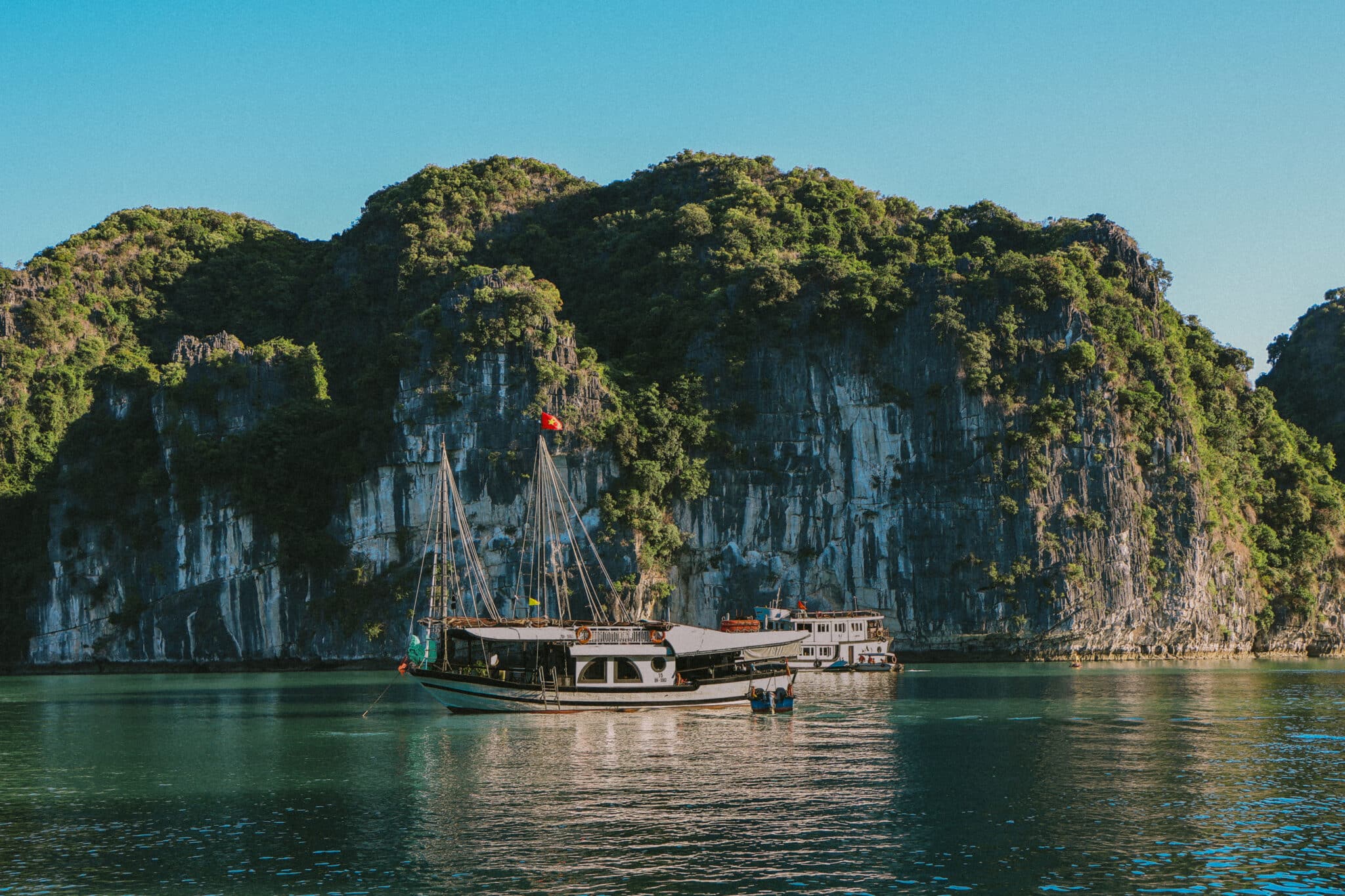 L'Amour Junk on a private Ha Long Bay cruise, with limestone karsts.