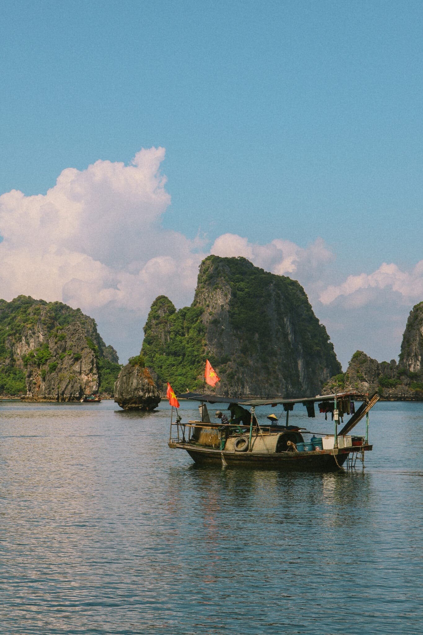 L'Amour Junk boat on a private Ha Long Bay cruise amidst limestone karsts