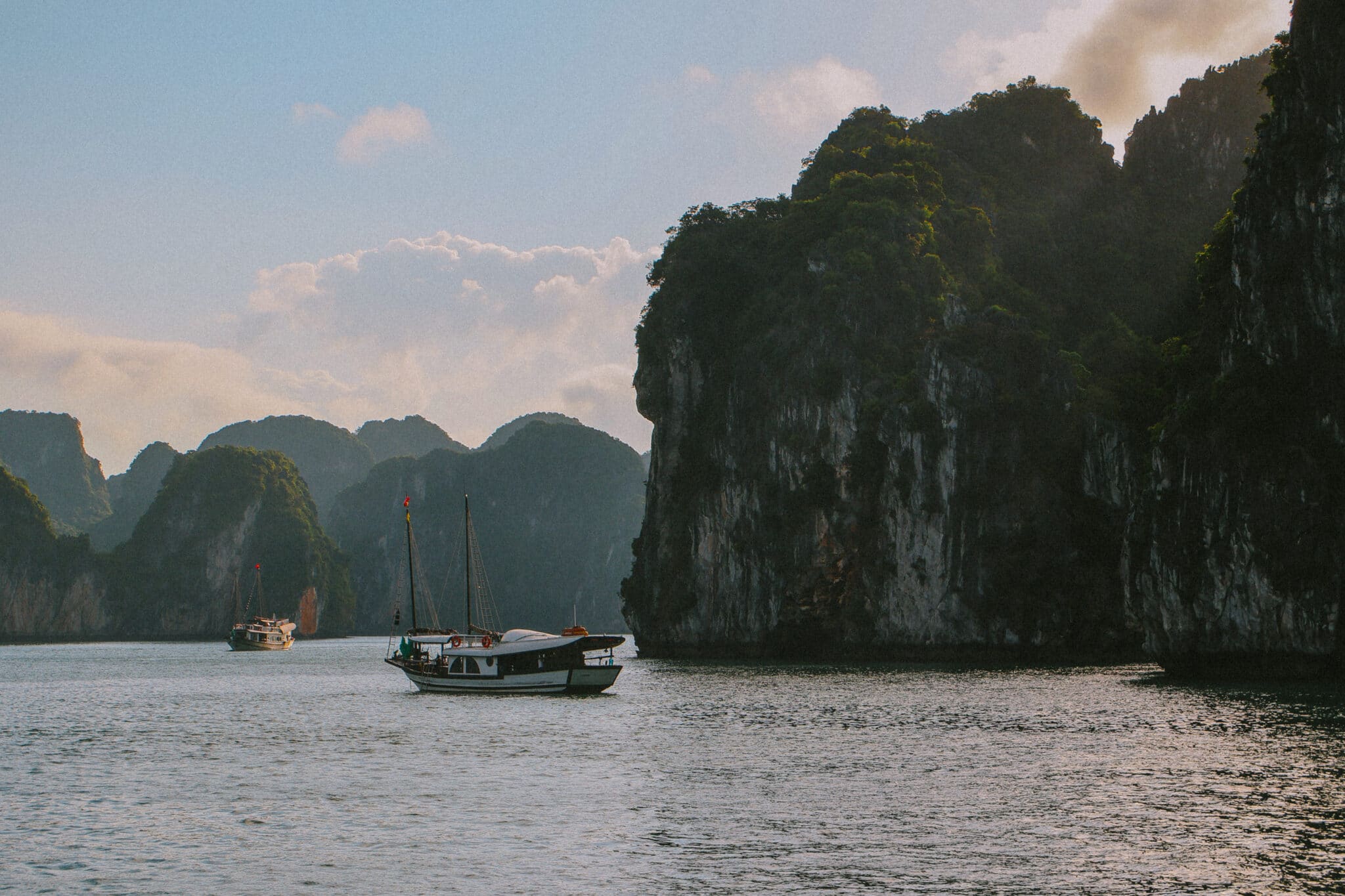 L'Amour Junk on a private Ha Long Bay cruise past karst islands