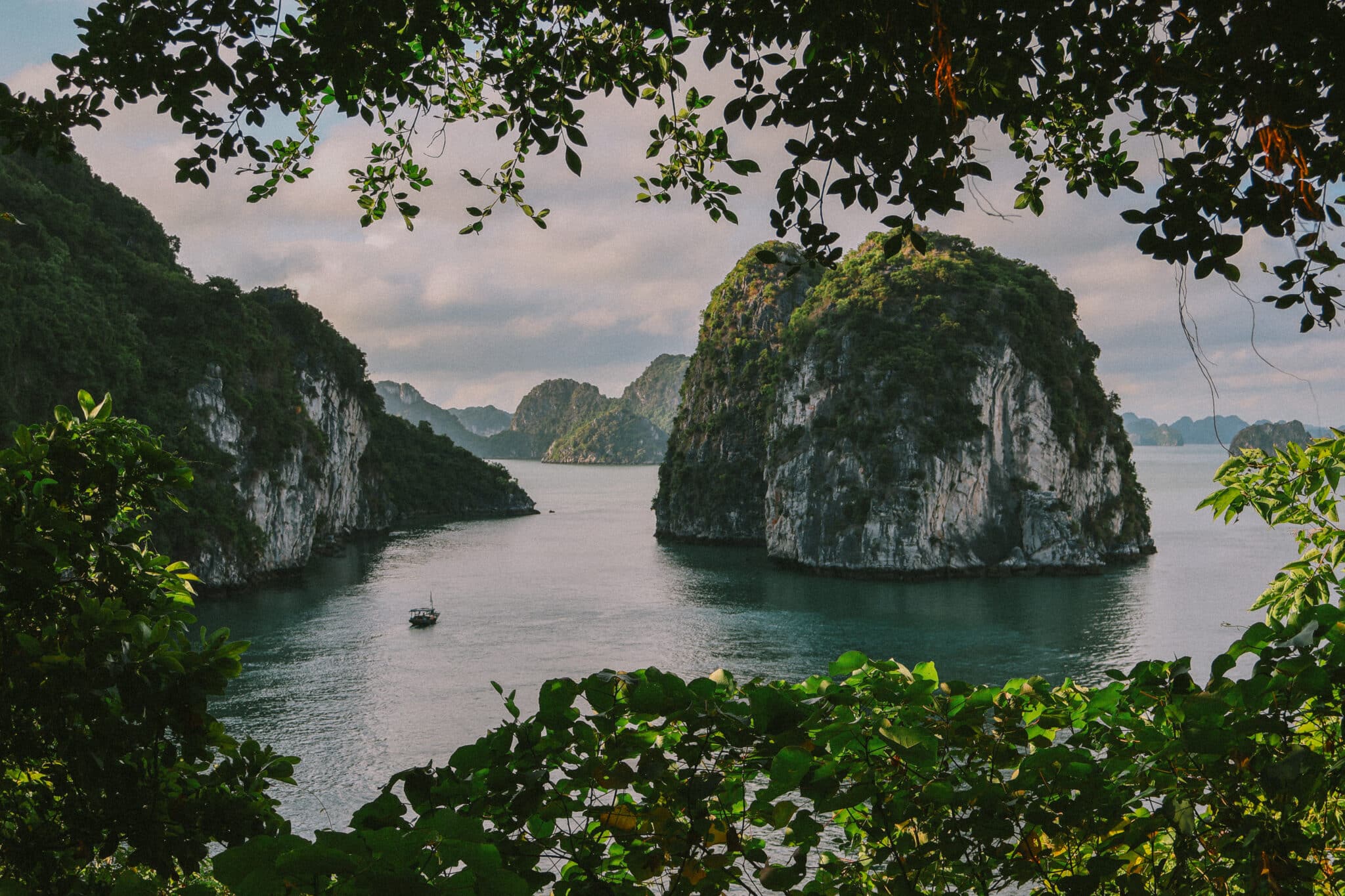 L'Amour Junk on a private Ha Long Bay cruise past limestone karsts