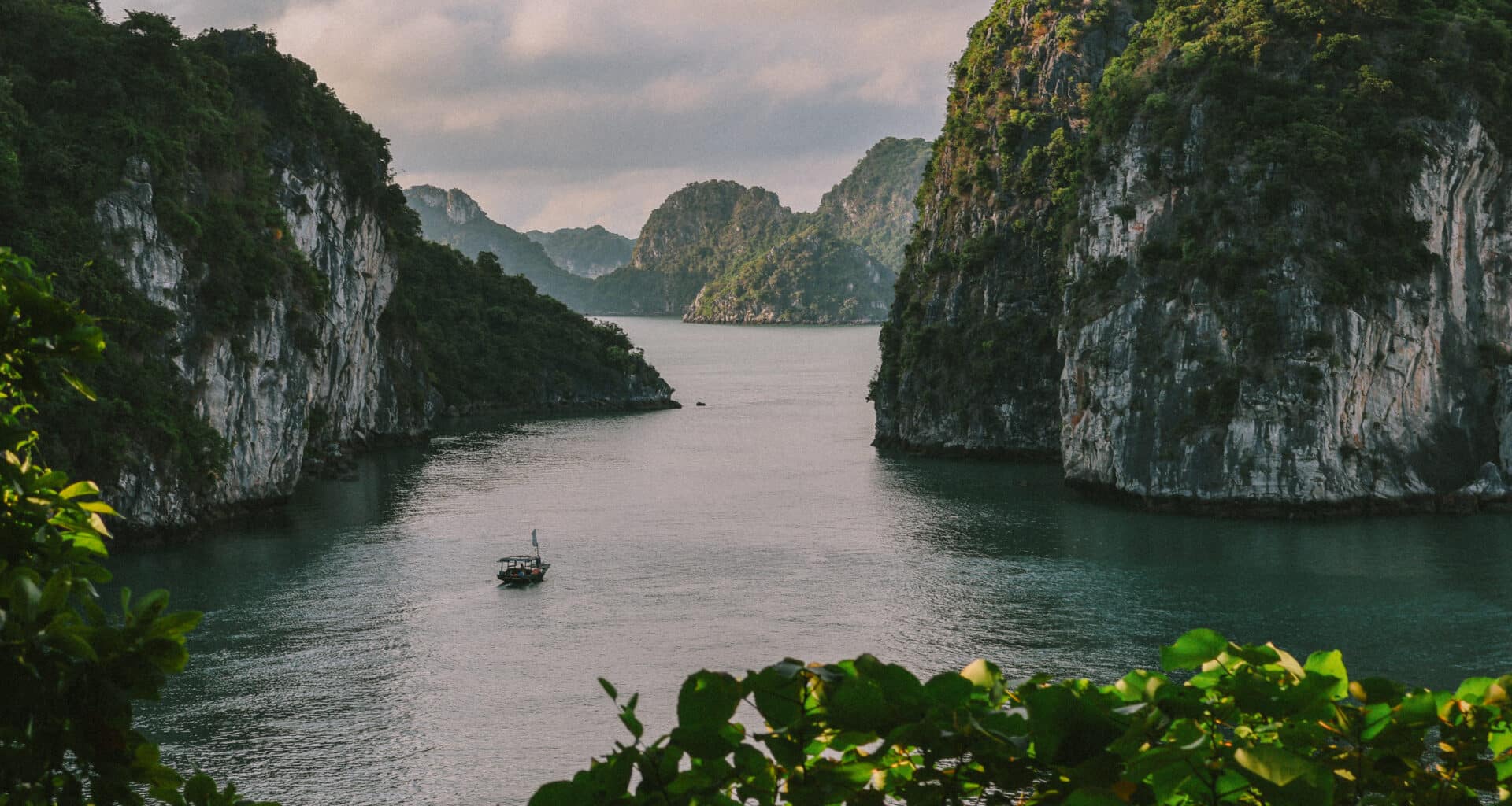 L'Amour Junk on a private Ha Long Bay cruise amidst limestone karsts.