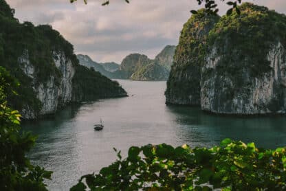 L'Amour Junk on a private Ha Long Bay cruise amidst limestone karsts.