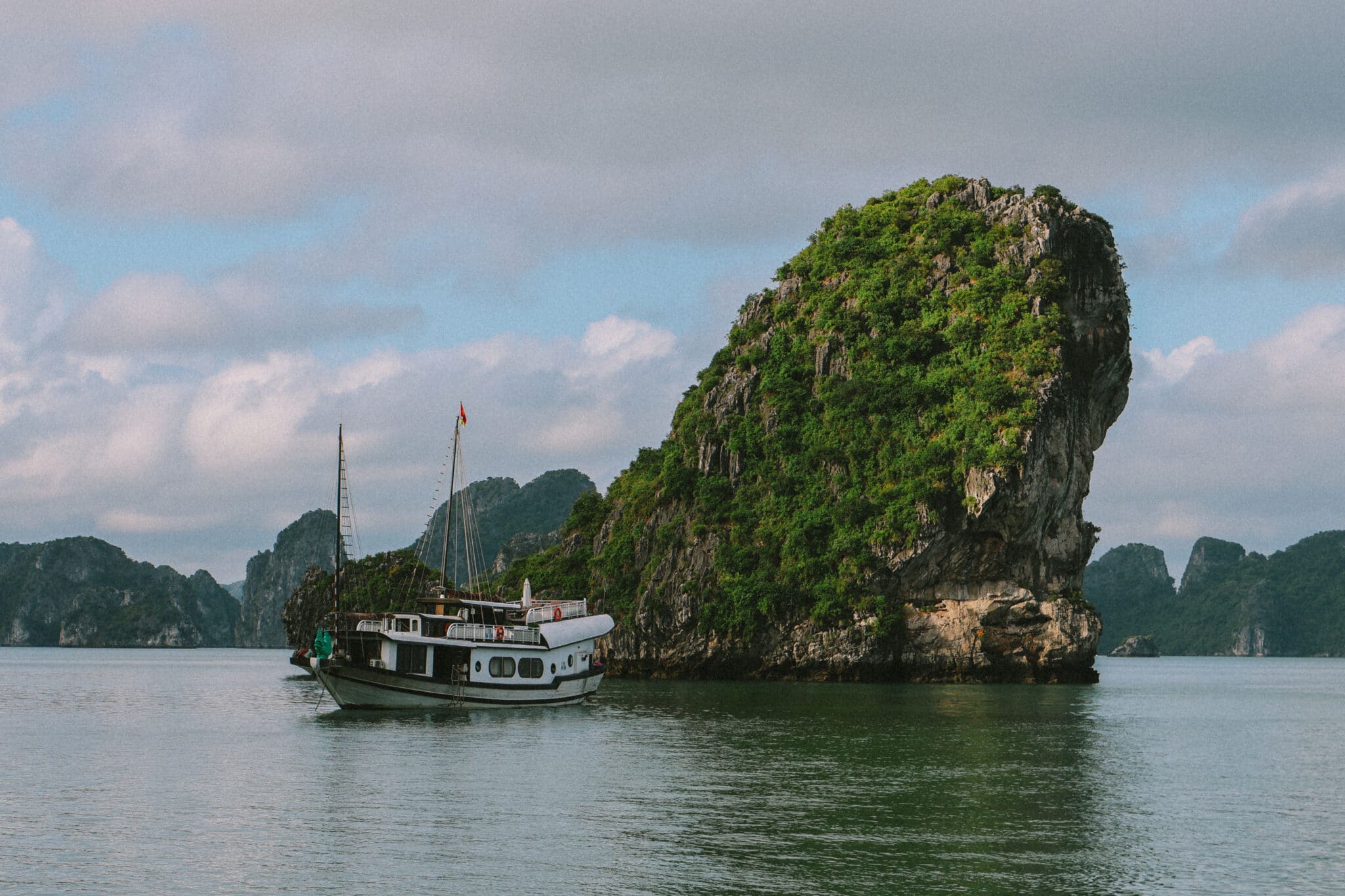 L'Amour Junk on a private Ha Long Bay cruise amid karst islands.