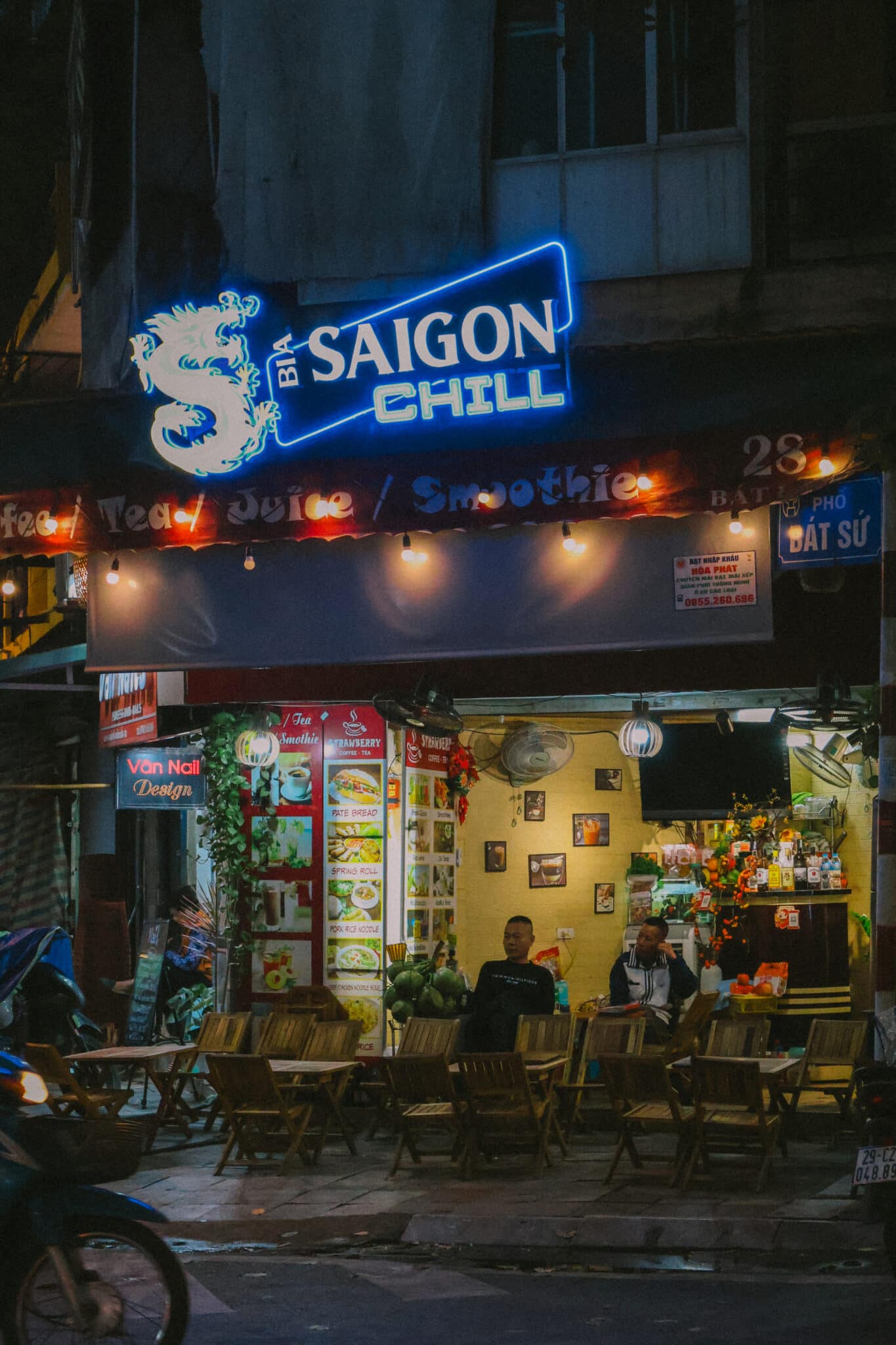Saigon Chill cafe sign in Hanoi's Old Quarter, serving tea, juice, and smoothies.