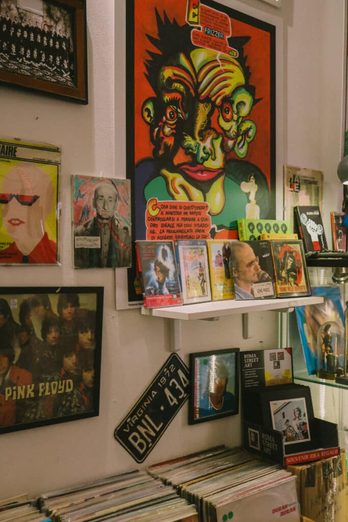 Rome shop display with vintage records, including Pink Floyd, and art posters.