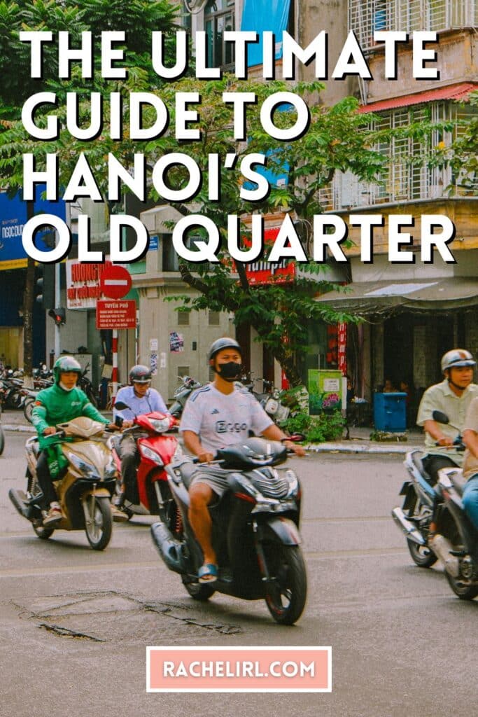 Motorbikes navigate a busy street in Hanoi's Old Quarter.