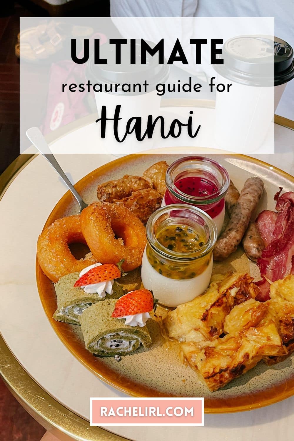 Ultimate Hanoi restaurant guide featuring a breakfast platter with donuts, fruit, and bacon