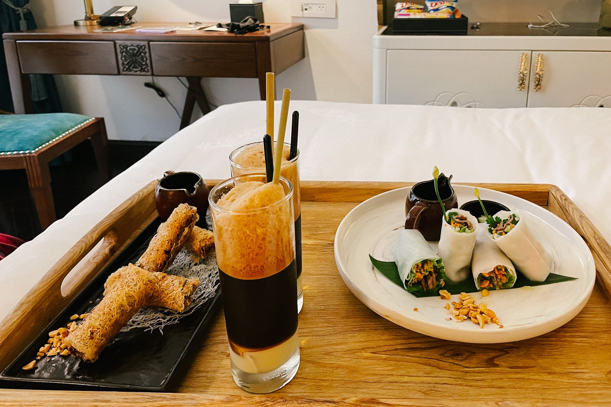 Hanoi food tray: fresh spring rolls and crispy snacks with Vietnamese coffee