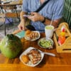 Hanoi street food: grilled pork and rice with coconut and condiments